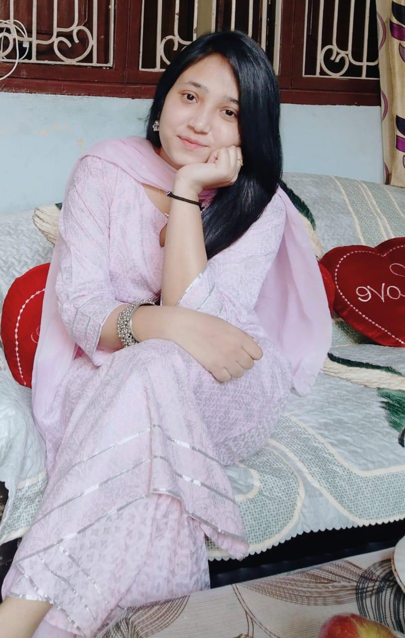 Sadaf smiling in a lovely pink outfit